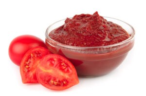 Hakkımızda 6 tomato paste on the plate with tomatoes
